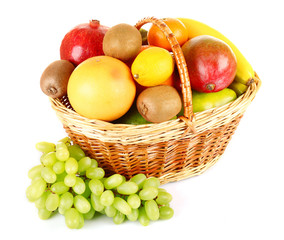 Assortment of fruits in basket isolated on white