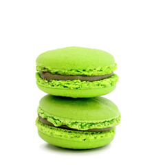 colorful macaroons over white background
