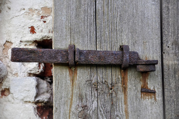 Part of the antique wooden door and pivot hook