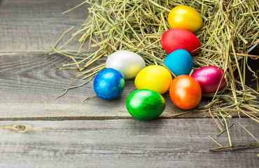 Colorful easter eggs in brown basket