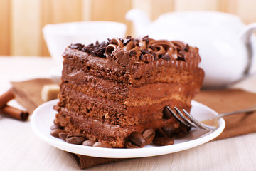 Tasty piece of chocolate cake with mint and cinnamon