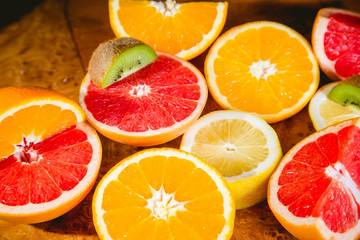 fruit salad, sliced fruit, kiwi, orange, lemon, grapefruit