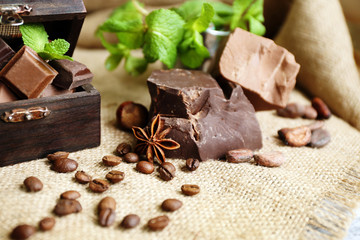 Still life with set of spicy chocolate, nuts and coffee beans