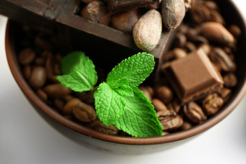 Still life with set of chocolate, nuts and coffee grains,