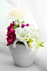 Beautiful spring flowers on windowsill background