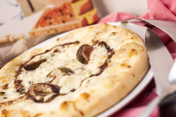 Pizza cheese and figs.