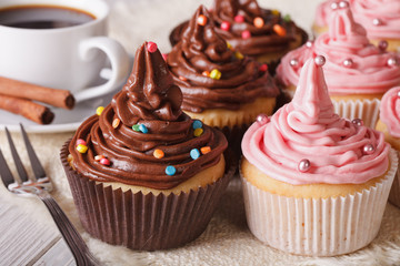 Delicious cupcakes and coffee on the table. Horizontal close-up