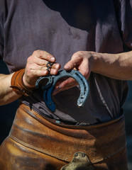 farrier showing horsehoes