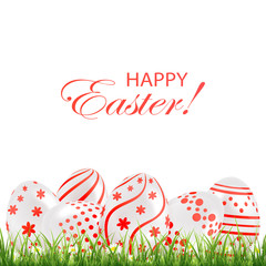 Red Easter eggs in the grass