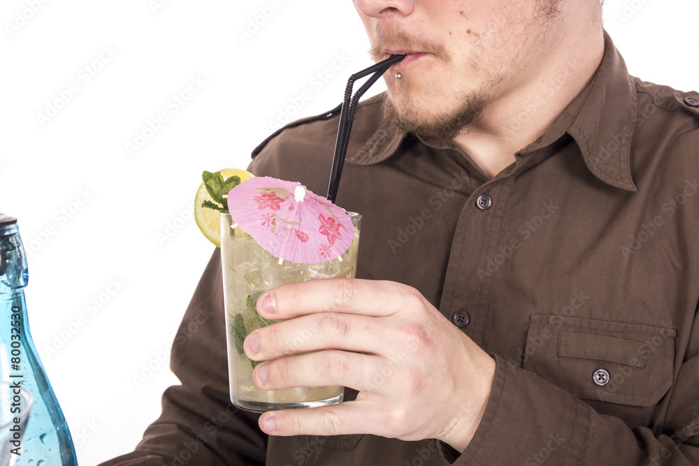 Wall mural Bartender preparing mojito cocktail drink, with limes, ice and b