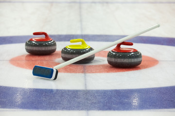 Curling rocks on ice - obrazy, fototapety, plakaty