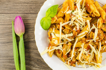Pasta with mushrooms, minced meat, tomatoes and cheese
