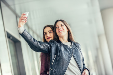 Happy girls taking a Selfie. Selective focus
