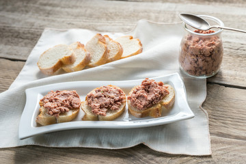 Sandwiches with pate on the wooden board