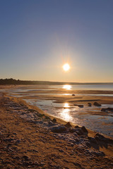 Northern seashore landscape with sunset