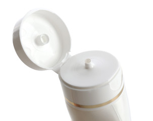 Open cosmetic bottle isolated on white