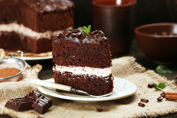 Delicious chocolate cake on table close-up