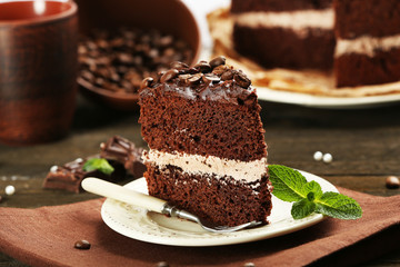 Delicious chocolate cake on table close-up