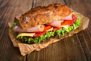 Fresh and tasty sandwich with ham and vegetables
