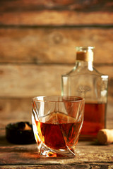 Whiskey on wooden background