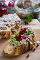 spreading chicken liver or goose pate on wholegrain bread