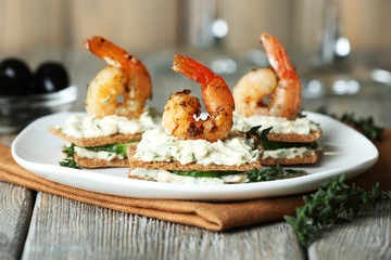 Appetizer canape with shrimp and cucumber