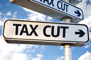 Tax Cut direction sign on sky background