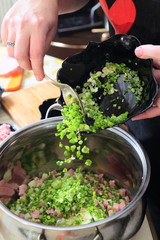 Preparing russian traditional salad Olivier