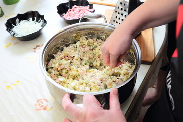 Preparing russian traditional salad Olivier