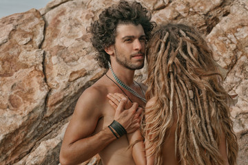 Young pair on the stone beach in Phangan