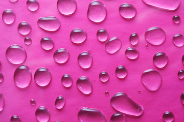 drops of water on a pink background