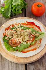 Tortilla with chicken, tomatoes,  salad