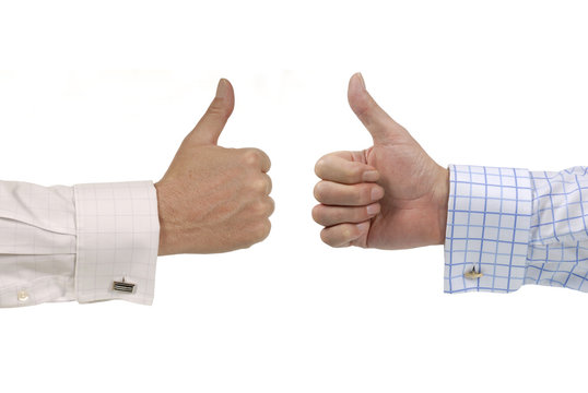 Two businessmen giving thumbs up signs deal agreement isolated on white photo