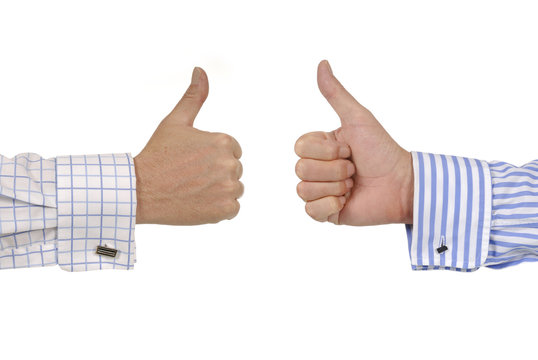 Two businessmen giving thumbs up signs for business deal agreement isolated on white photo