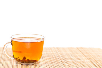 transparent tea cup on wooden background