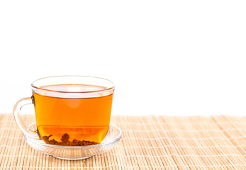 transparent cup of tea on wooden background