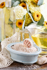 Bowl of sea salt and jug of liquid soap