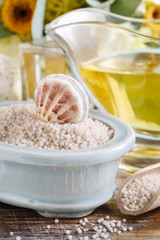 Bowl of sea salt and jug of liquid soap