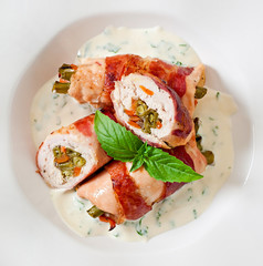 Delicious chicken rolls stuffed with green beans and carrots 