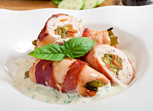 Delicious chicken rolls stuffed with green beans and carrots 