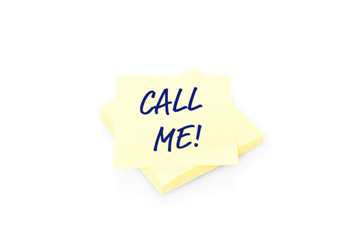 Yellow sticky note on block with text Call Me