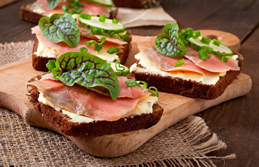 Small snacks sandwiches with salty salmon