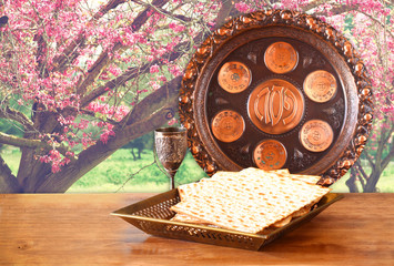 passover background. wine and matzoh (jewish passover bread) on 