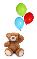 Cute teddy bear holding colorful balloons © bluebat