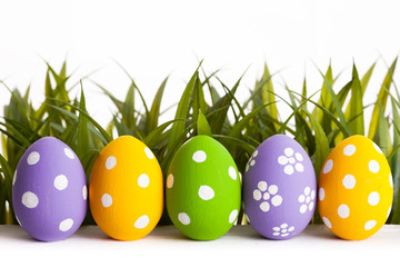 Row of Easter eggs in Fresh Green Grass