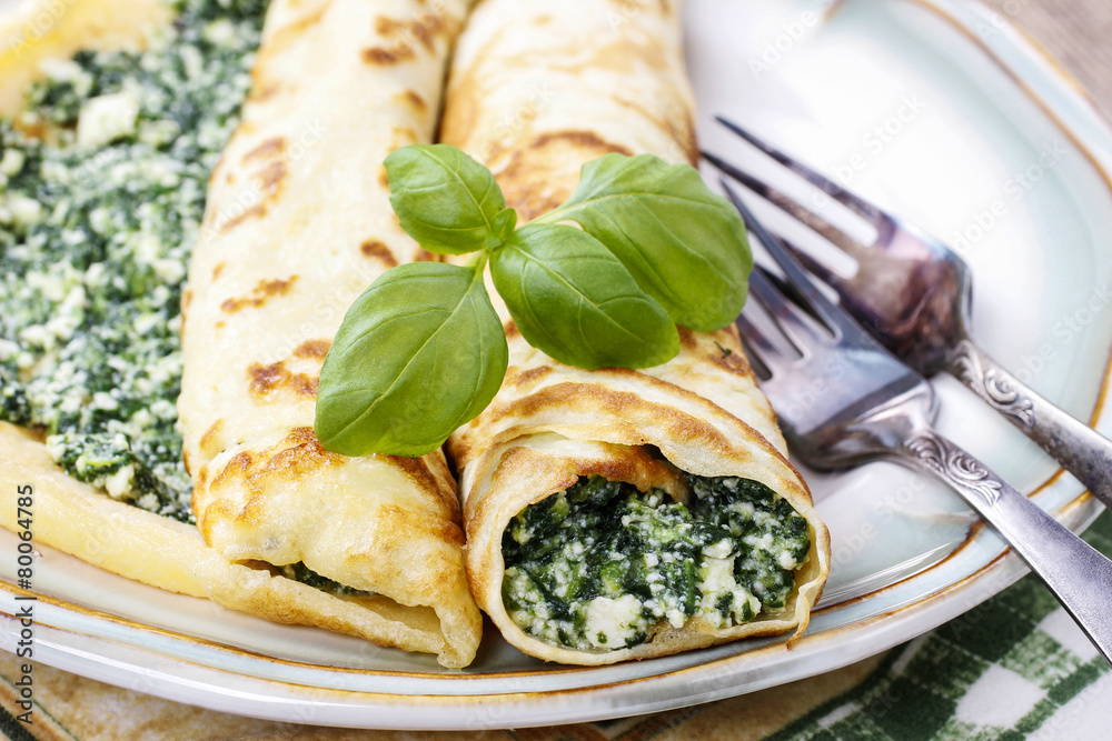 Poster crepes stuffed with cheese and spinach