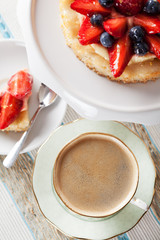Coffee and tartlet with custard and berries