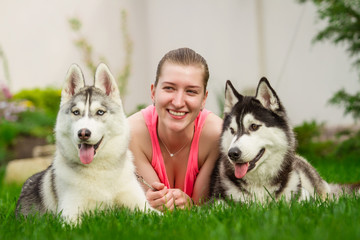 beautiful young girl playing with dog outdoor