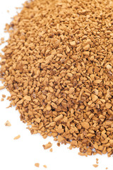 Granules of instant coffee on a white background