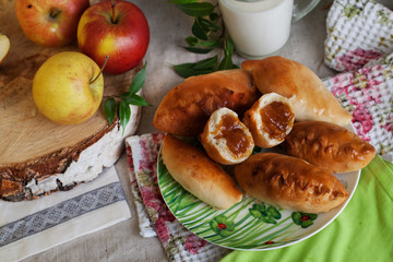 rustic still life with pies, apple jam and milk